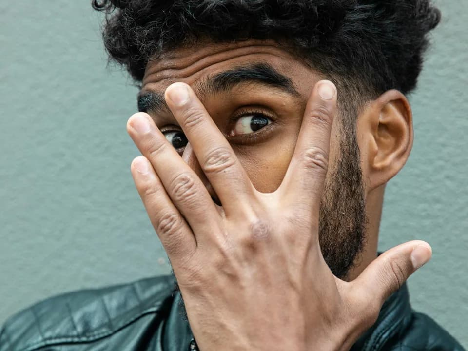 Man with curly hair for frizz control routine