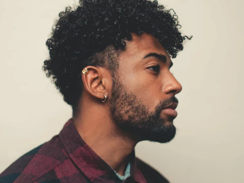 Man with short curly hair